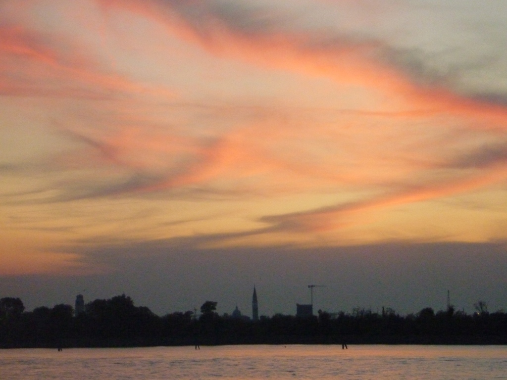 The sunset over Venice, seen from the Lido after our return