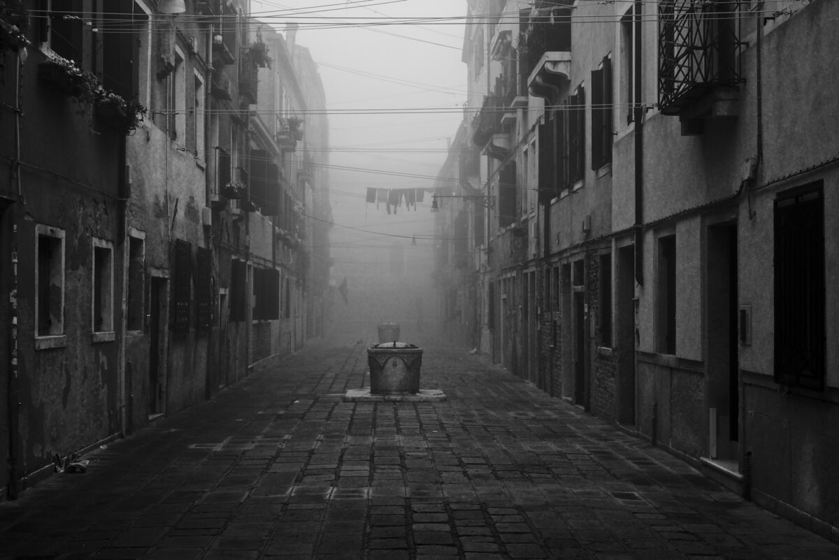 Corte Nova (Castello) in Venice with the ancient well head on a foggy morning.