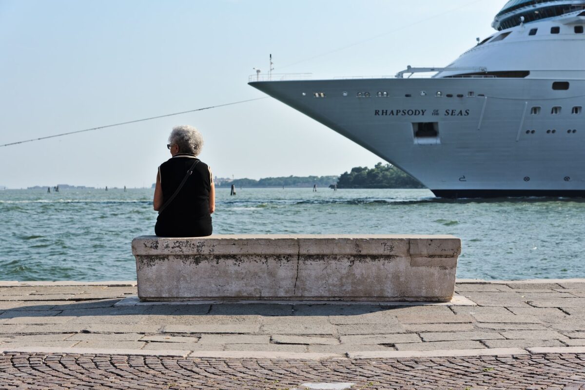 Elderly lady trying not to watch criuse ship passing