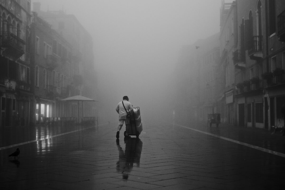 The local bakery doing an early delivery of bread in the Via Garibaldi in Venice, on a very foggy morning.