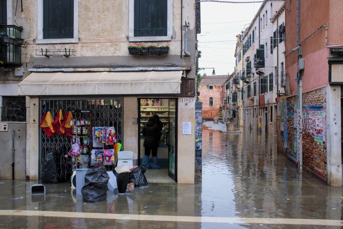 Shopkeepers cleaning up the day after 