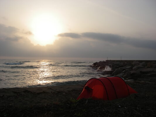 The camp on the beach near Porto Corallo