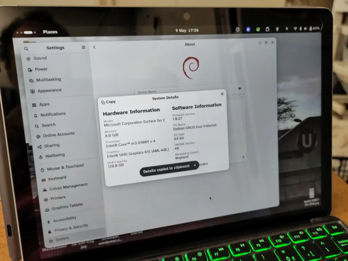 Screenshot of Gnome and Debian on a Microsoft Surface Go 2 tablet, with some information about the hardware.